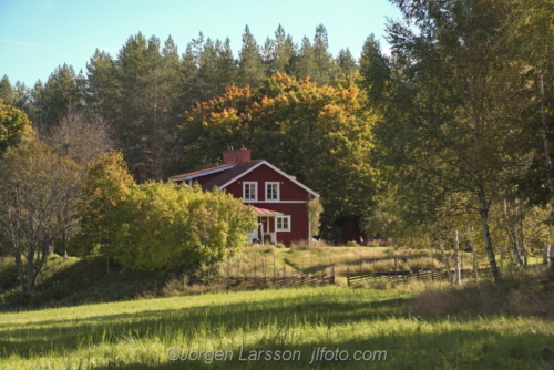 Dammhult Sodermanland Sweden Red house in autumn