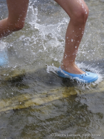 Girl running in water
