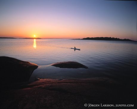 Canoe in sunset Smaland Sweden