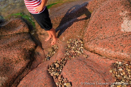 Kvinna klippor strand